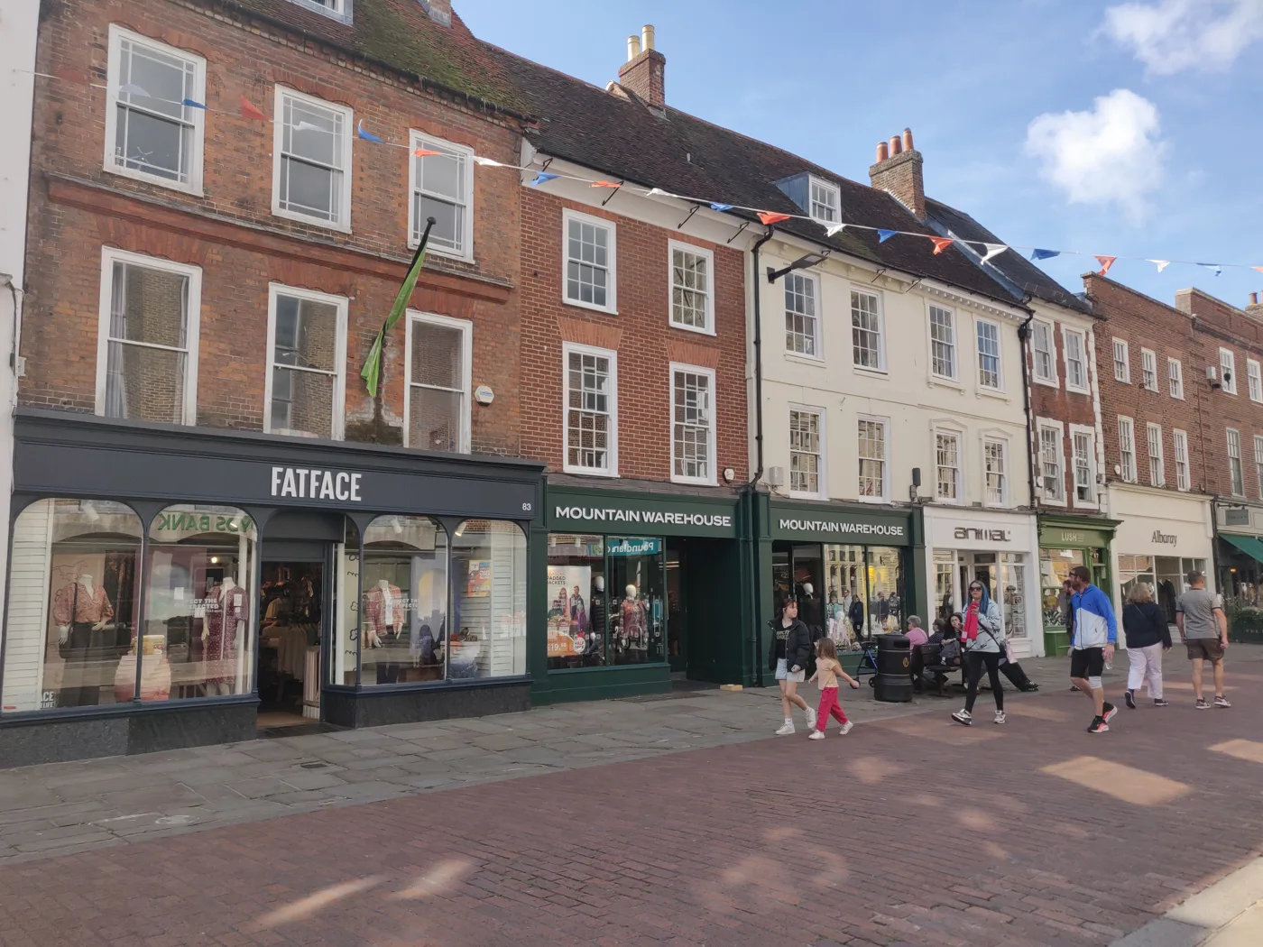 Shoppers on East Street, Chichester. The photo shows the street only; none of the shops pictured is linked to any report in these figures
