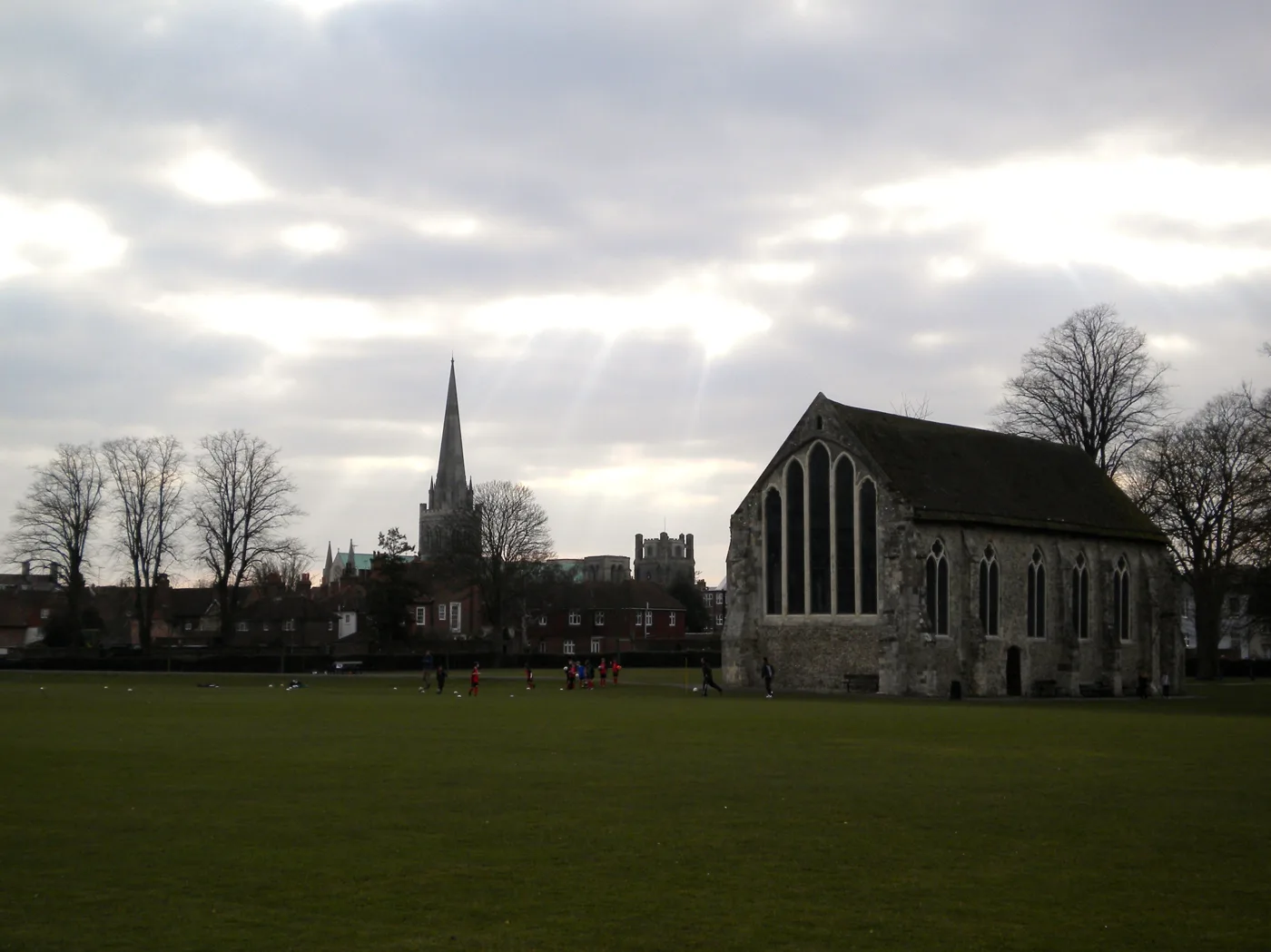 Priory Park, Chichester, with the Greyfriars chapel and the cathedral spire behind.