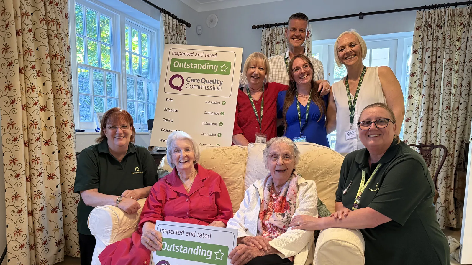 Home Instead Chichester & Bognor Regis staff and clients with the agency's CQC Outstanding posters. The picture was published with the agency's announcement and may predate this assessment.