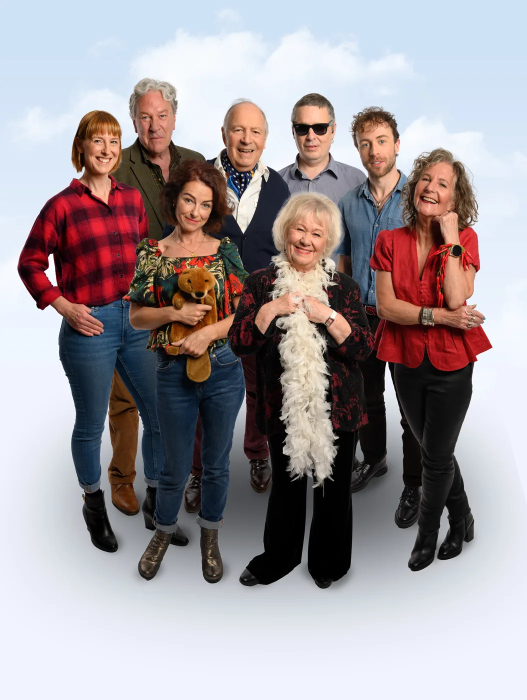 The Archers: Live at 75 tour cast posed together against a pale blue sky